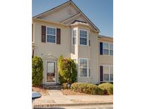 Charming townhome with a bay window and low-maintenance landscaping for easy curb appeal at 2877 Deerwood Sw Dr, Atlanta, GA 30331