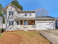 Charming two-story home with stone accents, a cozy front porch, and a well-manicured lawn at 5595 Wylmoor, Norcross, GA 30093