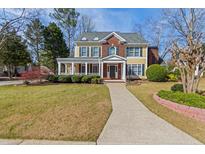 Charming two-story home with a well-manicured lawn and inviting walkway at , Marietta, GA 30062