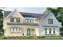 Charming two-story home with a covered porch and beautiful architectural details at 6841 Phillips Mill Rd, Douglasville, GA 30135