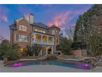 Gorgeous backyard boasts a sparkling pool, beautiful stone steps, and an entertainer's patio at 5321 Whitehaven Park Se Ln, Smyrna, GA 30082