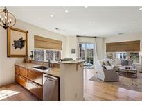 Bright, open concept kitchen flows into the living area with hardwood floors and modern finishes at 1430 Dresden Ne Dr # 200, Atlanta, GA 30319