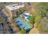 Aerial view of community amenities, including a tennis court and swimming pool at 1846 Liberty Ln, Roswell, GA 30075