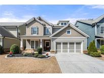 Beautiful two-story home with a manicured lawn and a two-car garage at 144 Still Pine Bnd, Smyrna, GA 30082