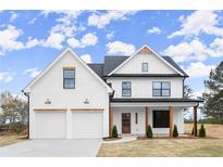 Charming two-story home with white siding, black trim, and inviting front porch at 5010 Hyde Way, Cumming, GA 30040