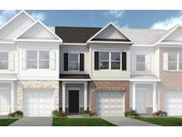 Charming townhome with brick and siding, offering a welcoming entrance and well-maintained landscaping at 317 Skye Ln # 51, Cartersville, GA 30121