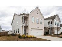 Charming two-story home boasts a brick facade, two-car garage, and a cozy balcony at 3739 Silvery Way, Powder Springs, GA 30127