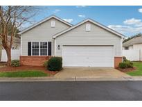 Charming single Gathering home with a two-car garage and neatly maintained front yard at 328 Windcroft Nw Cir, Acworth, GA 30101