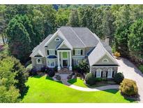 Beautiful home with lush landscaping, stone accents, and grand entrance at 2330 Blackheath Trce, Alpharetta, GA 30005