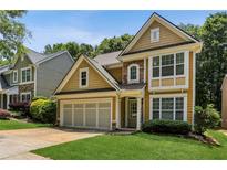 Charming home with a two-car garage and manicured lawn at 3277 Wyesham Cir, Duluth, GA 30096