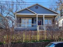 Charming two-story home with a covered porch and inviting curb appeal at 971 Martin Se St, Atlanta, GA 30315