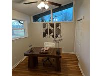 Bright office with hardwood floors, modern decor, and natural light from large windows at 1027 Goza Rd, Fayetteville, GA 30215