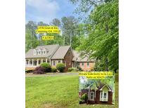 Beautiful brick home on 5 acres with lush landscaping and an in-law suite with a private entry at 3550 Gravitt Rd, Cumming, GA 30040