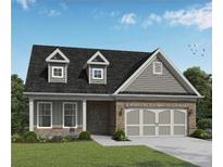 Charming single-Gathering home with a brick facade, dormer windows, and a two-car garage, perfect for comfortable living at 2469 Anhinga Dr, Loganville, GA 30052