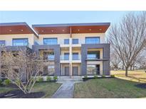 Contemporary townhome with clean lines, balcony, modern design, and well-maintained landscaping at 472 Martin Se St # 1, Atlanta, GA 30312