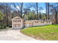 Charming home featuring a well-maintained yard and architectural details, great curb appeal at 3480 Hogan Sw Rd, Atlanta, GA 30331