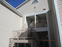 Exterior view of a home with stairs leading to the entrance at 4263 Parkview Ct, Stone Mountain, GA 30083