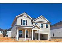 Two story home with bright siding, black shutters, and a two-car garage at 2704 Mourning Dove Dr Lot 34, Grayson, GA 30017