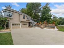 Spacious home featuring a two-car garage and charming landscape design that enhances its curb appeal at 3278 Winter Wood Ct, Marietta, GA 30062