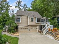 Charming two-story home featuring a two-car garage, multiple balconies, and inviting curb appeal at 3278 Winter Wood Ct, Marietta, GA 30062