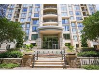 Elegant building entrance with manicured landscaping and water feature at 3445 Stratford Ne Rd # 2504, Atlanta, GA 30326