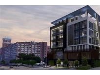 Modern apartment building exterior featuring sleek design, balconies and street view at 567 Ponce De Leon Ave # 506, Atlanta, GA 30308