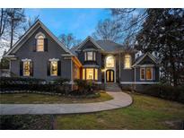 Stunning home with meticulously maintained lawn, mature trees, and stone accents at 740 Frank Kirk Nw Rd, Kennesaw, GA 30152