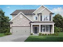 Charming two-story home with a blend of brick and siding, complemented by a well-manicured lawn and a two-car garage at 3906 Lockaby Way, Lawrenceville, GA 30044
