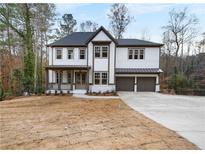Charming two-story home with a covered porch and a two-car garage at 2848 Tanner Lake Nw Trl, Marietta, GA 30064
