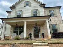 Charming two-story home with a brick facade and covered front porch at 812 Newsome Nw Aly, Marietta, GA 30064