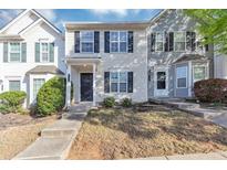 Charming townhome with a well-maintained front yard and welcoming entrance at 735 Crestwell Sw Cir, Atlanta, GA 30331