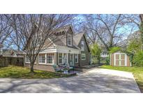 Charming cottage-style home with a landscaped front yard, brick foundation and a private driveway at 20 Screven Ne St, Atlanta, GA 30307