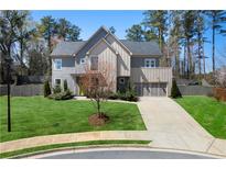 Charming two-story home with a manicured lawn, modern design, and a two-car garage in a suburban setting at 1732 Red Maple Rdg, Atlanta, GA 30316