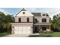 Charming two-story home with brick facade, symmetrical design, and manicured landscaping at 372 Waterbluff Dr, Mableton, GA 30126