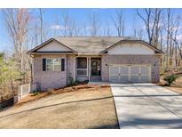 Charming brick home with two-car garage, front porch, and well-maintained lawn, perfect for a growing Gathering at 197 Saddleridge Dr, Bremen, GA 30110