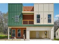 Modern two-story home featuring a covered front porch and a two-car garage at 2312 Herring Sw Rd, Atlanta, GA 30311