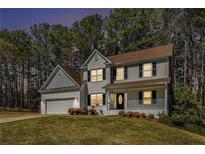 Charming two-story home with a landscaped front yard and a welcoming porch at 2404 Caneridge, Marietta, GA 30064