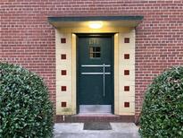 Apartment front door with the number 1148 with an interesting, symmetric facade and a small overhang for weather protection at 1148 Briarcliff Ne Rd # 1, Atlanta, GA 30306