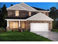 Charming two-story home featuring a stone facade, covered entry, and a two-car garage on a well-manicured lawn at 6910 Winchester Pl, Fairburn, GA 30213