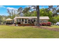 Inviting single story home featuring a quaint deck and beautiful landscaping for outdoor relaxation and enjoyment at 24 Allatoona Landing Rd #29, Cartersville, GA 30121