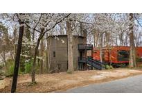 Unique home design with multi-level decks nestled among the trees at 595 Overbrook Nw Dr, Atlanta, GA 30318