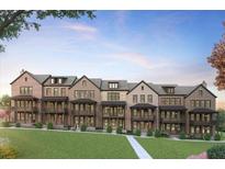 Beautiful brick townhomes feature covered balconies and landscaped front yards at 2276 Addington Way # 46, Brookhaven, GA 30319