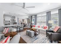 Elegant living room featuring an open floor plan, stylish furniture, and bright natural light at 2500 Peachtree Nw Rd # 207S, Atlanta, GA 30305