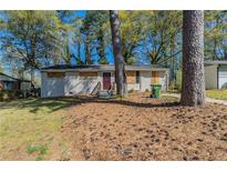 Charming single-story home with trees and lawn at 388 Belgarde Se Pl, Atlanta, GA 30354