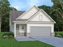 Charming single-Gathering home features a two-car garage and inviting entrance, surrounded by lush greenery at 1826 Butterfly Way, Marietta, GA 30066