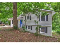 Charming exterior view of home featuring a bright blue front door and black shutters at 2270 Cresta Dr, Decatur, GA 30032
