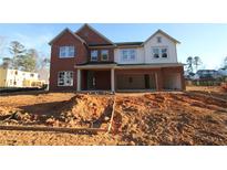 New construction two-story home featuring a two-car garage and a combination of brick and siding at 456 Maypop Ln, Woodstock, GA 30188