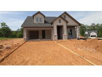 Charming new construction home with an open garage and stone detailing at 2055 Ripple Park Bend, Canton, GA 30114