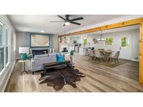 Open floor plan with modern decor includes a spacious living room that flows into dining area and kitchen at 3069 Thrasher Cir, Decatur, GA 30032