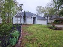 Charming single Gathering home with a well maintained lawn and 2 car garage at , Stone Mountain, GA 30087